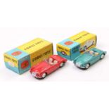 2 boxed Corgi Toys No. 302 M.G.A. Sports Car - one in red with flat spun hubs, and one in metallic