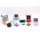 A group of Nintendo handheld consoles including Gameboy Micro in Green, Gameboy Color in Red,