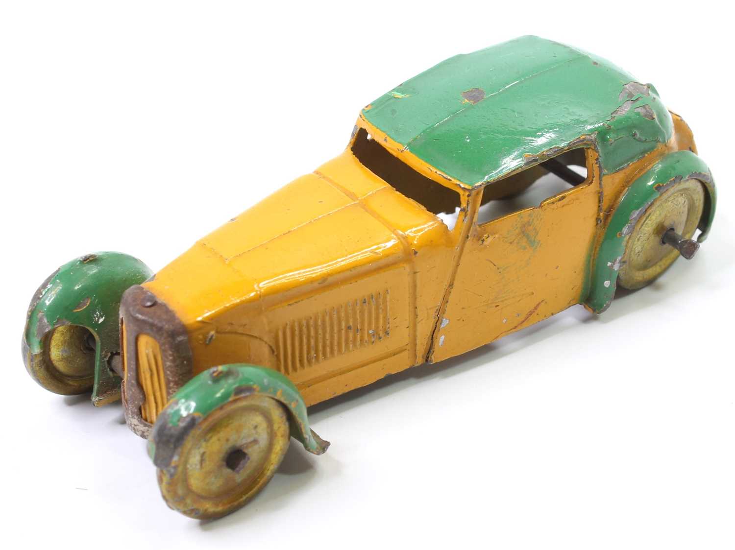 A Dinky Toys pre-war No. 22B closed sports coupe comprising yellow and green body with gold washed