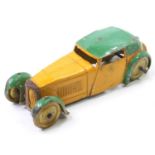 A Dinky Toys pre-war No. 22B closed sports coupe comprising yellow and green body with gold washed
