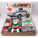 A Nitto No. 619-4800 1/12 scale plastic kit for a Lancia Stratos HF Safari type model kit race