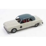 A Solido France diecast and clockwork 4 door saloon in grey with a blue-grey roof and red seats,
