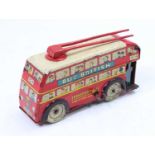 Wells Brimtoy large tinplate trolley bus, red with white roof and detailed tinprinted sides, with