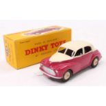 Dinky Toys No. 159 Morris Oxford saloon comprising of cream upper body with cerise lower body and