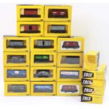 Twenty-two Trix plastic wagons in yellow & black boxes. Four are Wagonmaster Constructor. Individual