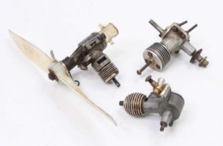 A collection of radio control and nitro powered aircraft engines, three loose examples to include
