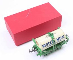 1936-9 Nestle’s Milk Tank Wagon, green standard base, ladder & ends, white tank. (E) repro (BE)