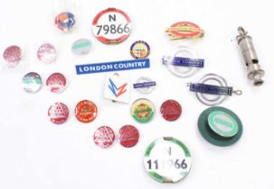 A collection of London Transport and public transport related enamel badges, whistles, and