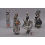 A collection of Lladro porcelain figures, the largest h.20cm (6)