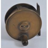 An unmarked 2 1/2" brass centre pin reel.