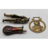 A repousse decorated copper powder flask; together with a brass Punch & Judy nutcracker; and a