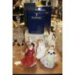 A collection of three Royal Doulton porcelain figures of ladies; together with a Royal Worcester