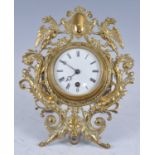 A Victorian brass strut clock, having an unsigned circular white enamel Roman dial, single winding