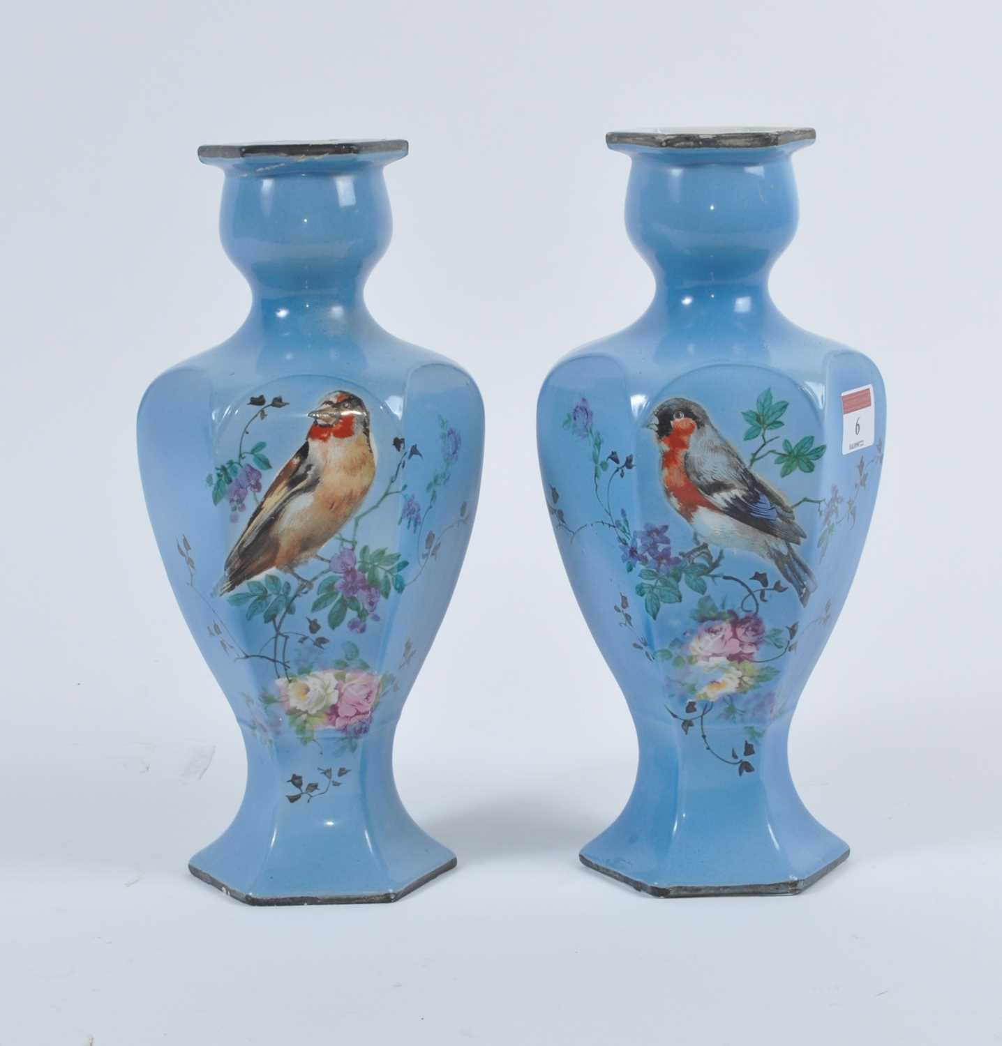 A pair of 20th century pottery vases, each decorated with birds amongst flowers, h.27cm