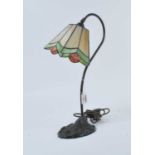 A Tiffany style table lamp, having coloured shade and moulded base, h.48cm