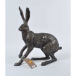 A modern bronzed model of a hare, h.49cm (a/f)