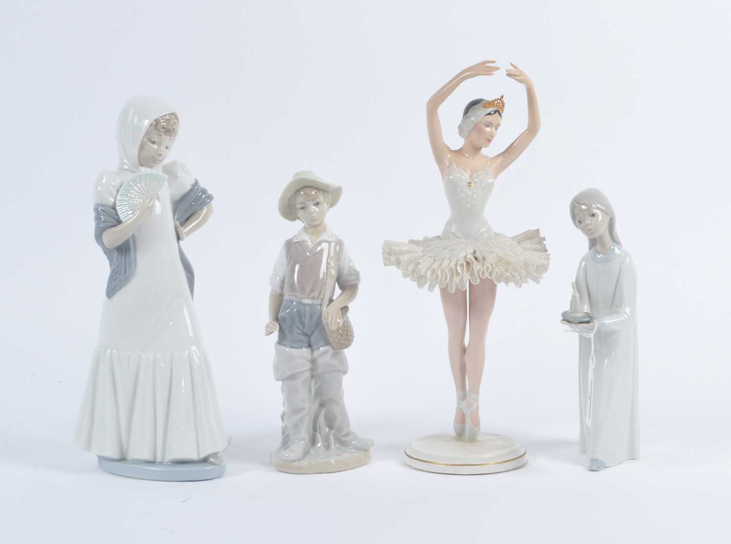 A Nao porcelain figure of a young girl, h.27cm; together with two other Nao porcelain figures; and a - Bild 2 aus 2