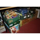 Seven boxes of mixed toys including jigsaws, mixed diecast, boxed games etc