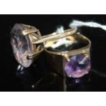 A modern 9ct gold amethyst set dress ring, size Q; together with one other having a large oval cut