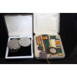 A miniature WWI Defence Medal WVS Civil Defence badge TLS air rads badge, and sundry coins