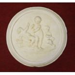 A set of four relief decorated plaster roundel wall plaques each dia.39cm