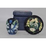 A Moorcroft Lamia pattern dish, boxed, dia.12cm; together with a Moorcroft Knypersley pattern