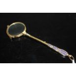 A pair of circa 1900 gilt metal and enamel set lorgnettes, 14cmThere is some minor damage to the