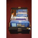 A box of model kits, to include Airfix, Italeri, and Matchbox