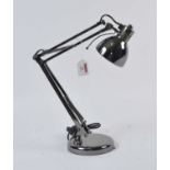 A modern plated anglepoise desk lamp