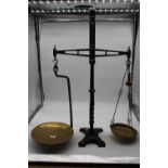 A pair of Todd of Cambridge brass and cast iron beam scales, h.77cm