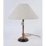 A 20th century brass table lamp, having cream shade, h.46cm