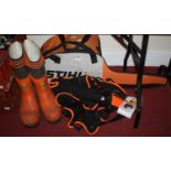 A Stihl chain saw, together with chain saw carry bag, spare chain, work boots and trousers