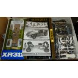 A boxed Tamiya XR311 combat support vehicle suitable for radio control with handset and charger