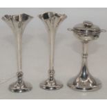 A pair of Edward VII loaded silver posy vases, Birmingham 1903, h.14cm; together with a George V