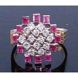 A yellow and white metal, ruby and diamond abstract cluster ring, comprising fourteen round