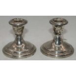 A pair of Alvin loaded sterling silver dwarf table candlesticks, h.9cm