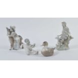 A Lladro porcelain figure of a young shepherd; together with three other Lladro groups, the