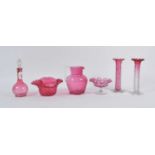 A collection of Victorian cranberry glassware, to include a water jug and decanter, the largest h.