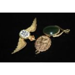 An RAF yellow metal and enamel set wings brooch, stamped 9ct, 4.2g, 52mm; together with a 9ct gold