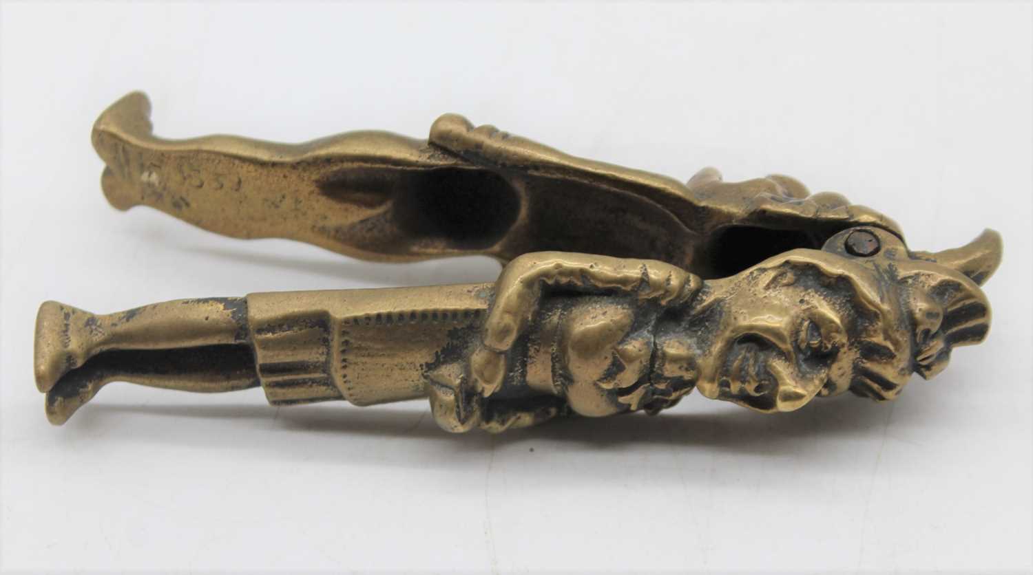 A repousse decorated copper powder flask; together with a brass Punch & Judy nutcracker; and a - Image 3 of 10