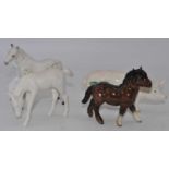 A Beswick model of a foal, No.1813, grey gloss, h.11cm; together with another foal; a pony; and a