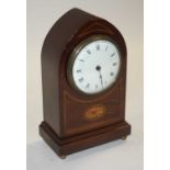 An Edwardian mahogany boxwood strung lancet mantel clock, the enamelled dial showing Roman numerals,