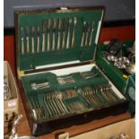 A mid-20th century oak cased canteen of silver plated flatware