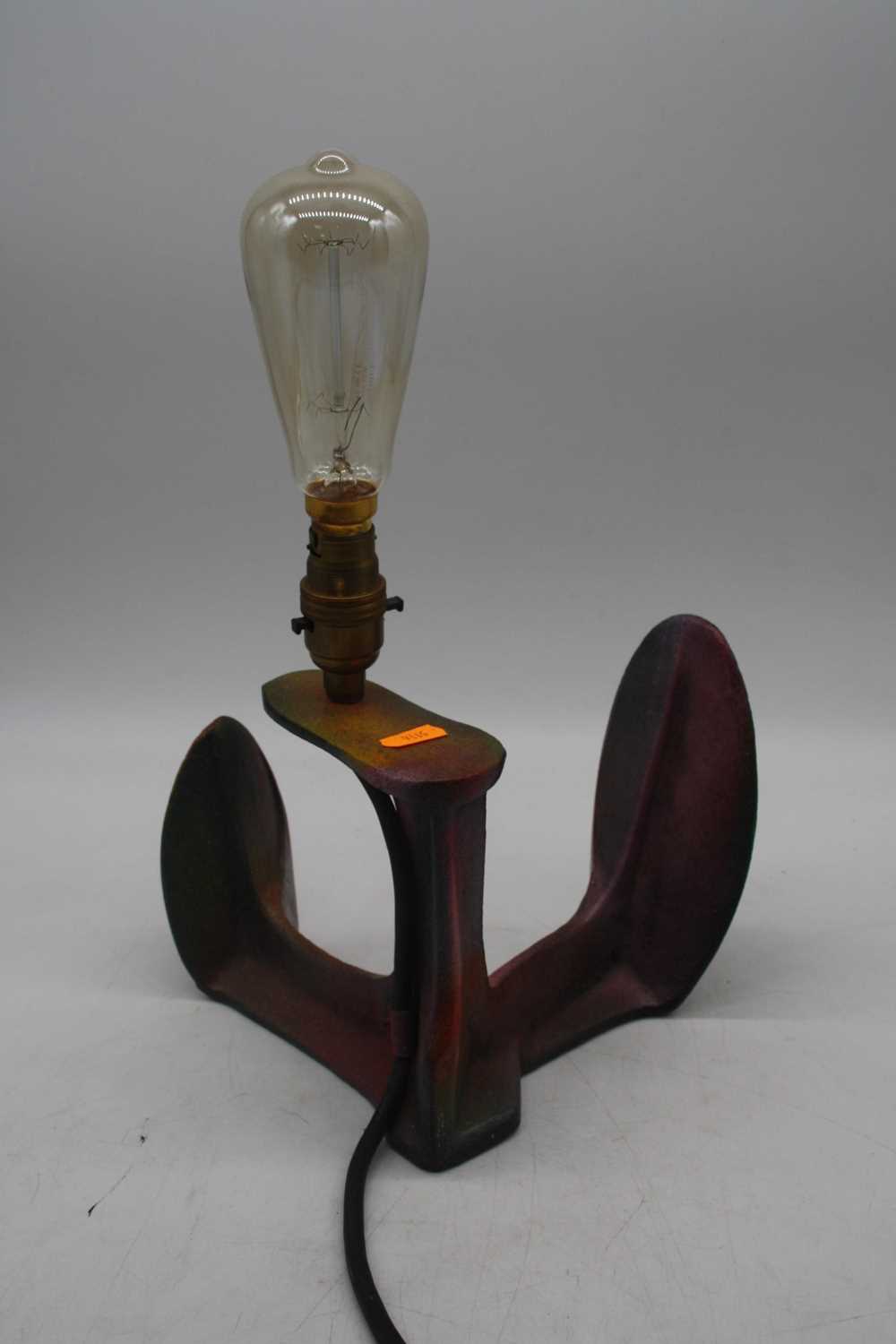 A cast iron shoe-last converted into a table lamp