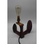 A cast iron shoe-last converted into a table lamp