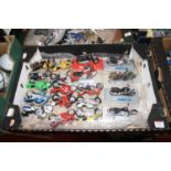 A collection of scale model motorcycles to include Maisto Harley Davidson 2000 Sportster, Triumph