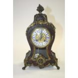 A 19th century French boulle inlaid eight-day mantel clock, having enamelled Roman numerals