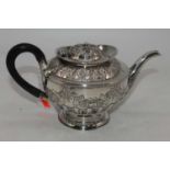 A Victorian silver teapot, repousse decorated with floral swags and bows, Birmingham 1892, 12.2oz