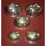A collection of five silver plated meat cloches, the largest 36 x 28cm