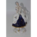 A Royal Dux porcelain figure of a lady, in 18th century dress, h.21cm